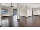 Spacious living room featuring dark hardwood floors and a sliding glass door at 822 Fairview Dr, Henderson, NV 89015