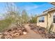 Side yard of a home with low-maintenance landscaping and cacti at 822 Fairview Dr, Henderson, NV 89015