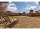 Relaxing backyard with lounge chairs, desert landscaping, and a serene atmosphere at 8501 Bellery Ave, Las Vegas, NV 89143