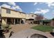Spacious backyard with patio, seating, lush green turf, and a charming flowering tree for outdoor relaxation at 8501 Bellery Ave, Las Vegas, NV 89143