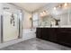 Spacious bathroom featuring double sinks, large mirror, and a separate shower at 8501 Bellery Ave, Las Vegas, NV 89143