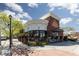 Upscale Juliette restaurant featuring a curved brick exterior, large windows, outdoor seating and lush landscaping at 8501 Bellery Ave, Las Vegas, NV 89143