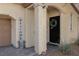 Close-up of the front door, complemented by a 'Welcome' sign and stylish decor at 8501 Bellery Ave, Las Vegas, NV 89143