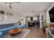 Spacious living room flowing into a modern kitchen, perfect for entertaining guests at 8501 Bellery Ave, Las Vegas, NV 89143