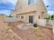This backyard has a private patio, low-maintenance landscaping, and a privacy fence at 8748 Tomnitz Ave # 103, Las Vegas, NV 89178