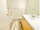 Bathroom with a single sink vanity and a shower-tub combo at 8748 Tomnitz Ave # 103, Las Vegas, NV 89178