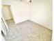 A carpeted bedroom with an open closet door and light walls at 8748 Tomnitz Ave # 103, Las Vegas, NV 89178