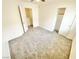 Bedroom featuring plush carpet, a window, and closet with sliding doors at 8748 Tomnitz Ave # 103, Las Vegas, NV 89178