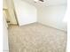 Spacious bedroom features plush carpeting and a ceiling fan, offering a cozy and comfortable atmosphere at 8748 Tomnitz Ave # 103, Las Vegas, NV 89178