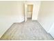 A carpeted bedroom with an open closet door at 8748 Tomnitz Ave # 103, Las Vegas, NV 89178