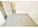 Bedroom with neutral carpet and a closet with sliding doors, offering extra storage space at 8748 Tomnitz Ave # 103, Las Vegas, NV 89178