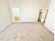 Inviting bedroom featuring neutral carpet and vaulted ceilings, and ensuite bath and closet entrances at 8748 Tomnitz Ave # 103, Las Vegas, NV 89178