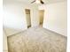 Bedroom featuring neutral carpet and a closet with sliding doors, offering storage at 8748 Tomnitz Ave # 103, Las Vegas, NV 89178