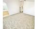 Carpeted bedroom with vaulted ceilings that provides access to an ensuite bath and closet at 8748 Tomnitz Ave # 103, Las Vegas, NV 89178