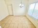 Cozy dining room featuring chandelier lighting and tile floors, perfect for casual meals at 8748 Tomnitz Ave # 103, Las Vegas, NV 89178