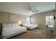 Bright and spacious bedroom with vaulted ceilings, two beds, and a window desk setup at 9446 Bondeno St, Las Vegas, NV 89123