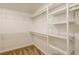 Walk-in closet offering ample shelving space for organized storage solutions at 9446 Bondeno St, Las Vegas, NV 89123