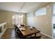 Elegant dining room with a long wooden table, perfect for hosting gatherings at 9446 Bondeno St, Las Vegas, NV 89123