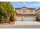 Elegant two-story home featuring a three-car garage, well-maintained landscaping, and a classic tile roof at 9446 Bondeno St, Las Vegas, NV 89123