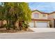 Elegant two-story home featuring a three-car garage, well-maintained landscaping, and a classic tile roof at 9446 Bondeno St, Las Vegas, NV 89123