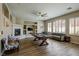 Spacious game room with a pool table, fireplace, and comfortable seating at 9446 Bondeno St, Las Vegas, NV 89123