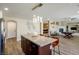 Open concept kitchen with island, pendant lighting, and easy access to dining and living spaces at 9446 Bondeno St, Las Vegas, NV 89123