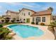 Inviting backyard pool with lush landscaping, perfect for outdoor entertaining and relaxation at 9446 Bondeno St, Las Vegas, NV 89123