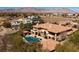 Stunning aerial view of the estate showcasing the pool, landscaping, and mountain views at 9801 Orient Express Ct, Las Vegas, NV 89145