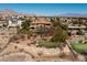 Aerial view of property with putting green, pool, and tennis court at 9801 Orient Express Ct, Las Vegas, NV 89145