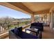 Relaxing covered patio with comfortable seating and scenic views of lush landscaping at 9801 Orient Express Ct, Las Vegas, NV 89145