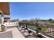Large balcony with ample seating, overlooking a pool, perfect for outdoor entertaining at 9801 Orient Express Ct, Las Vegas, NV 89145