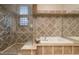 Detailed bathroom with a separate tiled shower and tub at 9801 Orient Express Ct, Las Vegas, NV 89145