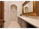 Charming bathroom with a vanity, decorative mirror and toilet at 9801 Orient Express Ct, Las Vegas, NV 89145