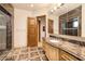 Elegant bathroom featuring marble floors, a vanity with marble countertop, and walk-in shower at 9801 Orient Express Ct, Las Vegas, NV 89145