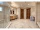 Grand bathroom boasting a large walk-in shower, stylish tile floors, and a beautiful vanity at 9801 Orient Express Ct, Las Vegas, NV 89145