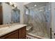 Modern bathroom showcasing a glass shower with a built-in seat and stylish vanity at 9801 Orient Express Ct, Las Vegas, NV 89145
