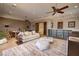 Spacious bonus room with multiple seating areas and stylish decor, perfect for relaxation and entertainment at 9801 Orient Express Ct, Las Vegas, NV 89145