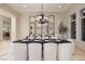 Elegant dining room with a long dark table set for a meal, with decoratively placed mirrors on the back wall at 9801 Orient Express Ct, Las Vegas, NV 89145