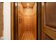 Classic residential elevator featuring wood paneling and a functional design at 9801 Orient Express Ct, Las Vegas, NV 89145