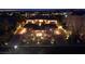 A stunning estate illuminated at night, showcasing lush landscaping, elegant architecture, and inviting ambiance at 9801 Orient Express Ct, Las Vegas, NV 89145