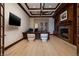 Stately office boasts a fireplace, dark wood trim, coffered ceiling, and a large desk space at 9801 Orient Express Ct, Las Vegas, NV 89145