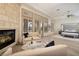 Bright and inviting main bedroom with a cozy seating area near the fireplace at 9801 Orient Express Ct, Las Vegas, NV 89145
