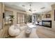 Charming main bedroom sitting area features a cozy fireplace and outdoor access at 9801 Orient Express Ct, Las Vegas, NV 89145