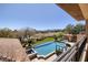 Luxurious outdoor pool area with lush landscaping and views of the surrounding area at 9801 Orient Express Ct, Las Vegas, NV 89145