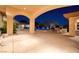 A luminous night view of the pool and patio area highlighting the architectural details and outdoor living space at 9801 Orient Express Ct, Las Vegas, NV 89145