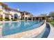 Expansive pool area with a view of the backyard and rear exterior of the home at 9801 Orient Express Ct, Las Vegas, NV 89145