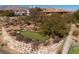 The putting green features sand bunkers and retaining wall at 9801 Orient Express Ct, Las Vegas, NV 89145