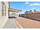 The backyard of this home has a gravel area and covered patio at , Las Vegas, NV 89108