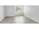 Bright bedroom featuring tile floors, a large window, and light walls at , Las Vegas, NV 89108