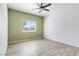 Bright bedroom with a ceiling fan, a window and wood-style flooring at , Las Vegas, NV 89108